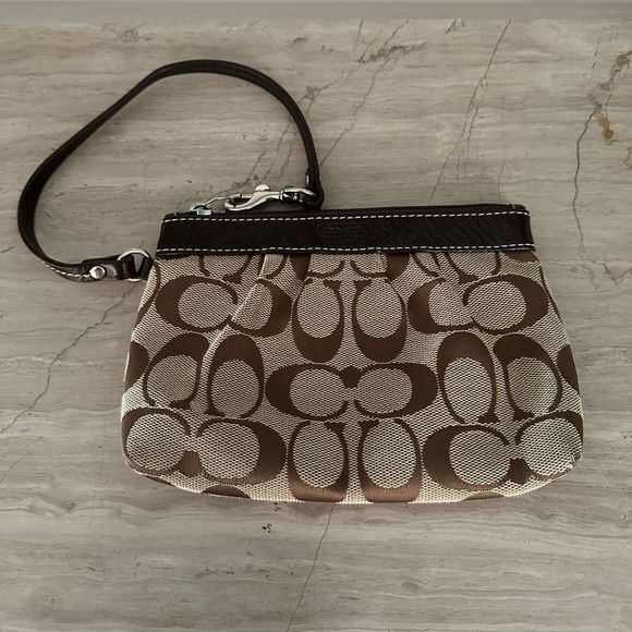 Coach tan with brown signature wristlet. - Picture 1 of 5